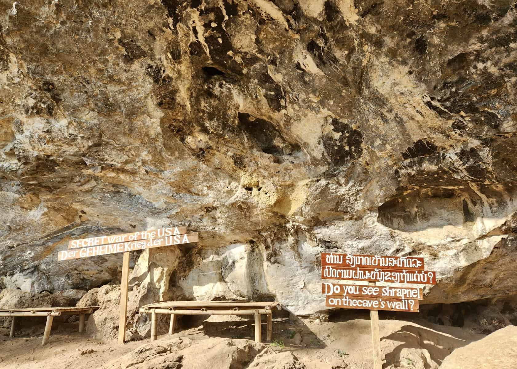 A sign that says Secret War of the USA in a cave in Nong Khiaw