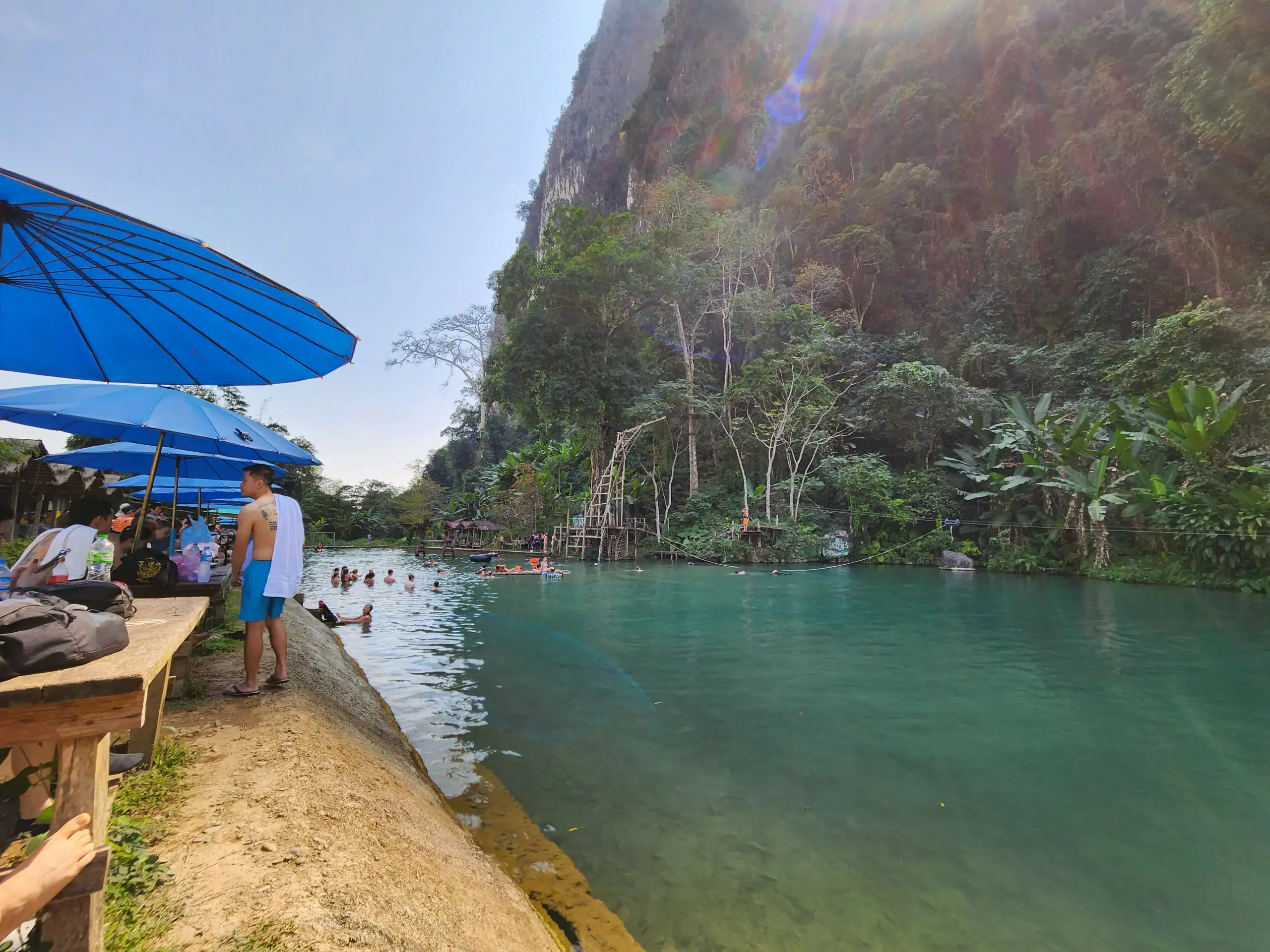 Blue Lagoon 3 in Vang Vieng is shown with blue water and green mountains below. This is a great stop if you have one week in Laos.