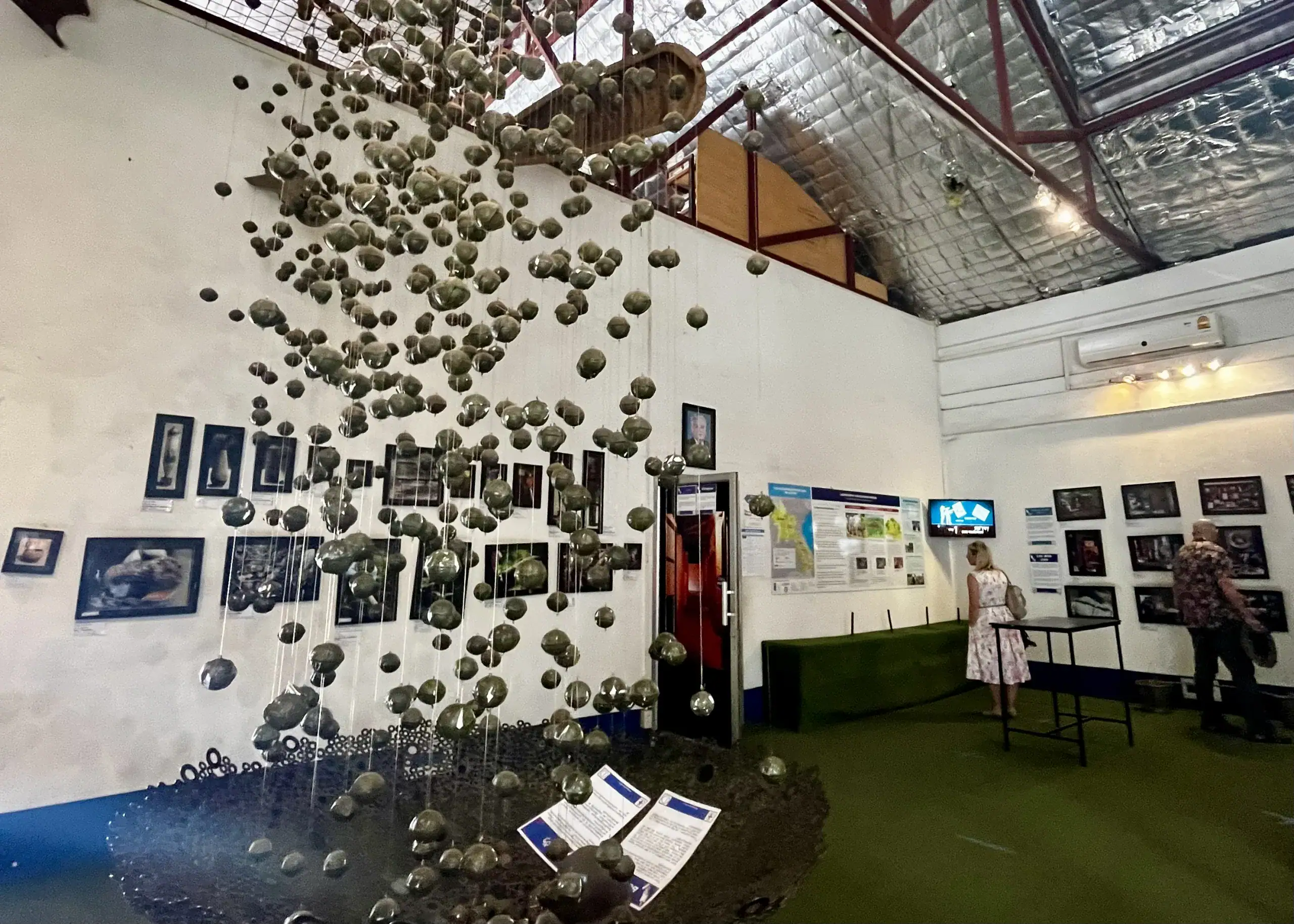 One Week in Laos: Create Your Own Custom Adventure Itinerary 6 Bombs from the Vietnam War are hanging from the ceiling at the COPE center in Vientiane, Laos.