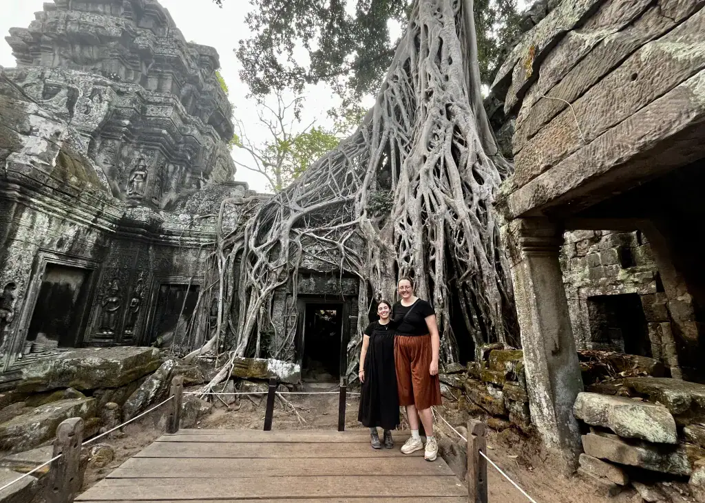 Best Angkor Wat Tour for Sunrise - Our Top Picks 8 Two girls stood at a temple on the Angkor Wat tour where Lara Croft was filmed