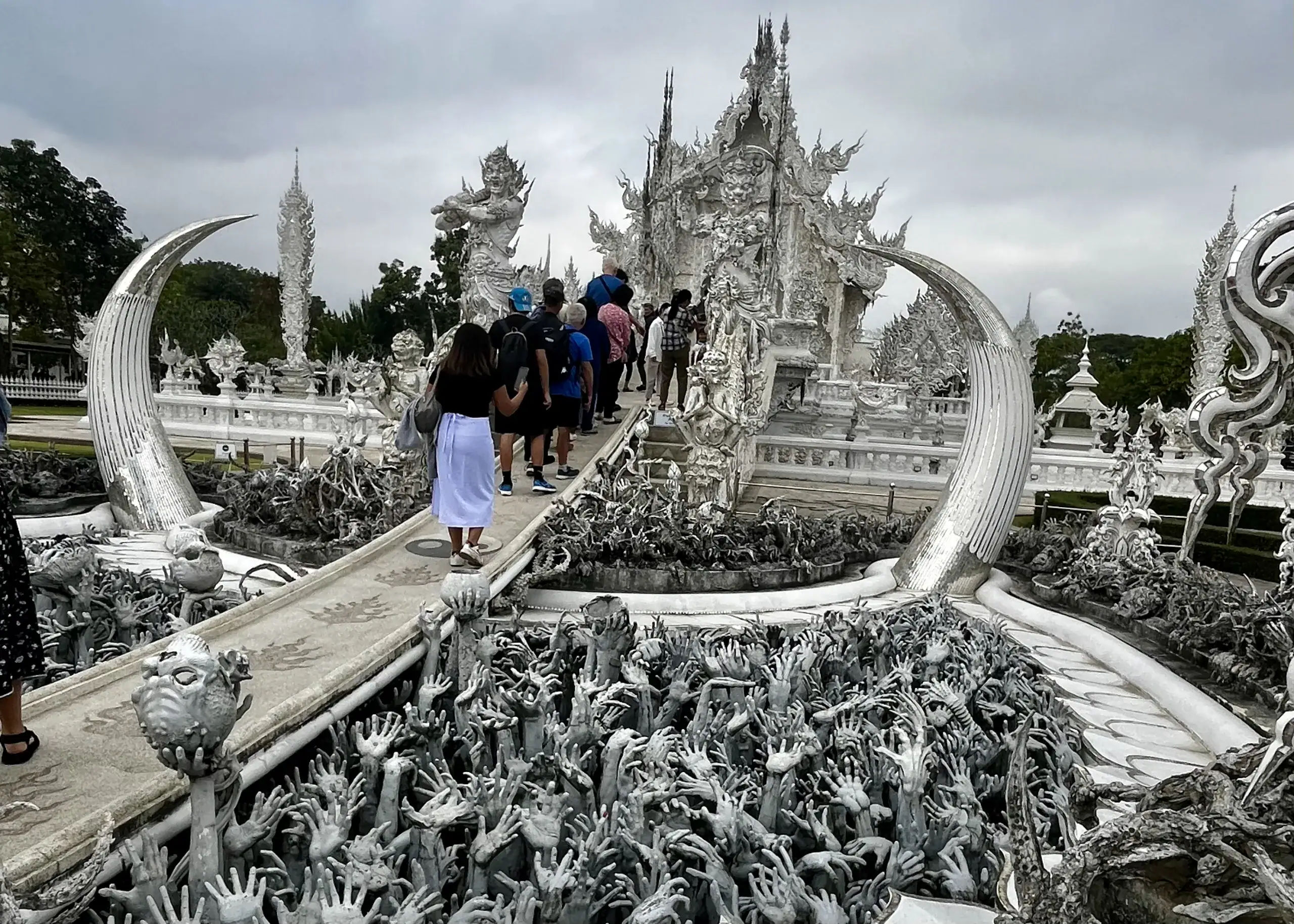 Chiang Mai or Chiang Rai: Which Is Better? 8 White Temple in Chiang Rai. There is a path running through the middle of the temple that is built from white stone