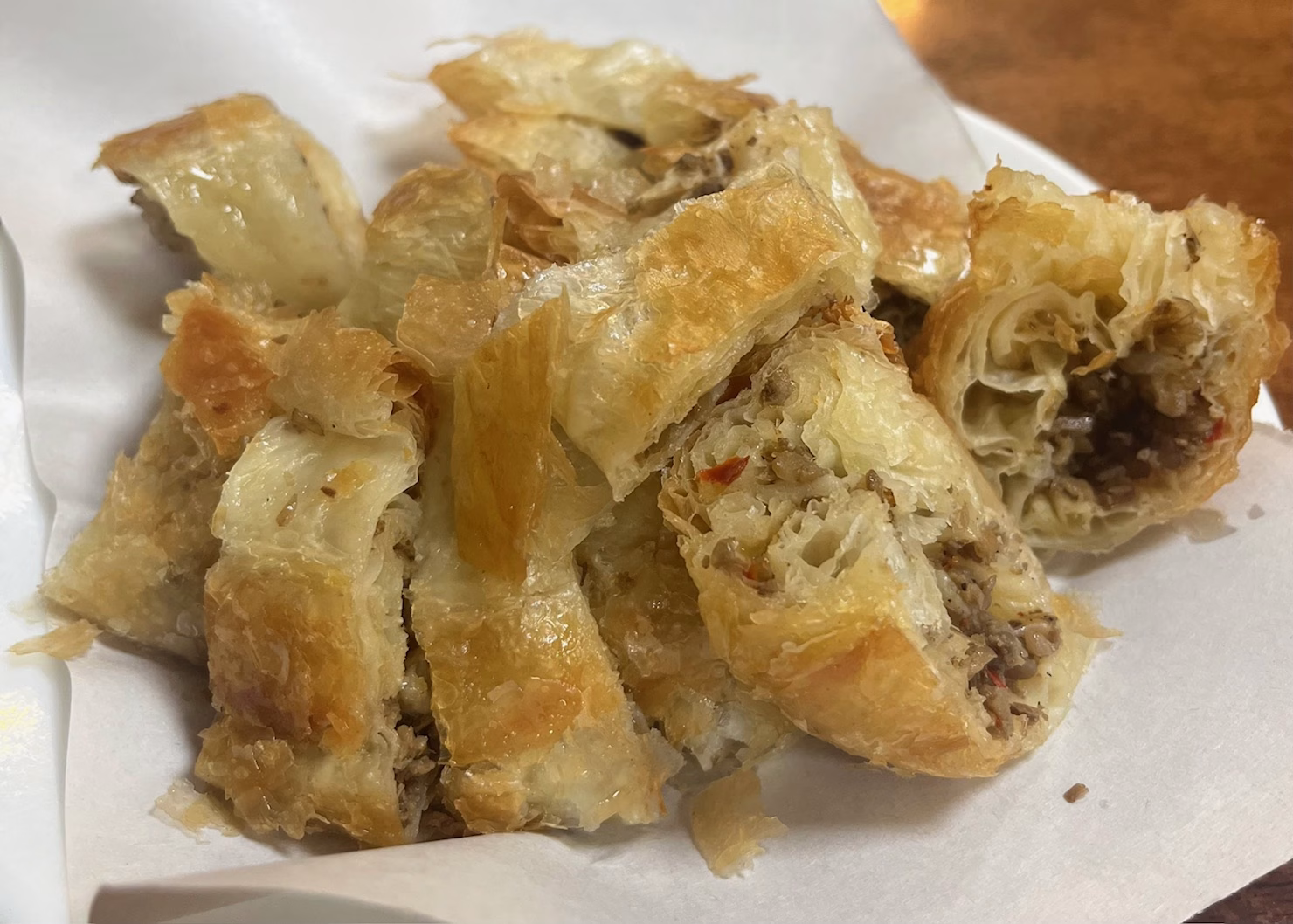 Albania 8 A close up of byrek, a classic Albanian dish. It is a puff pastry filled with meat, sliced and piled onto a plate