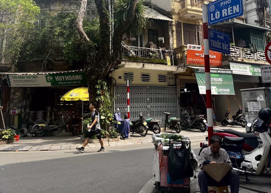 Where to Stay in Hanoi: Best Neighborhoods + Our Favorite Hotels 6 A view of a calm street in the morning outside of Hanoi Backpackers Hostel.
