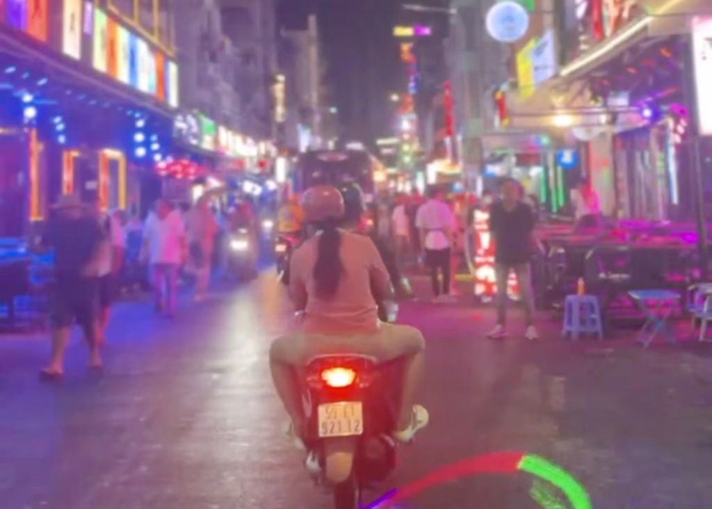 Laos or Vietnam: How to Choose the Best Country for Your Trip 25 Colorful Đ. Bùi Viện street lit up at night with tons of people walking under neon lights. This is an essential stop on any Ho Chi Minh itinerary.