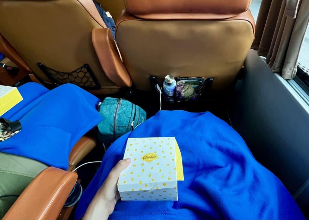 Bangkok to Chiang Mai Travel Guide — How to Get There by Train, Bus & Plane 11 A very nice bus with large, reclining seats, a blanket, and snacks provided on a sleeper bus in Vietnam.